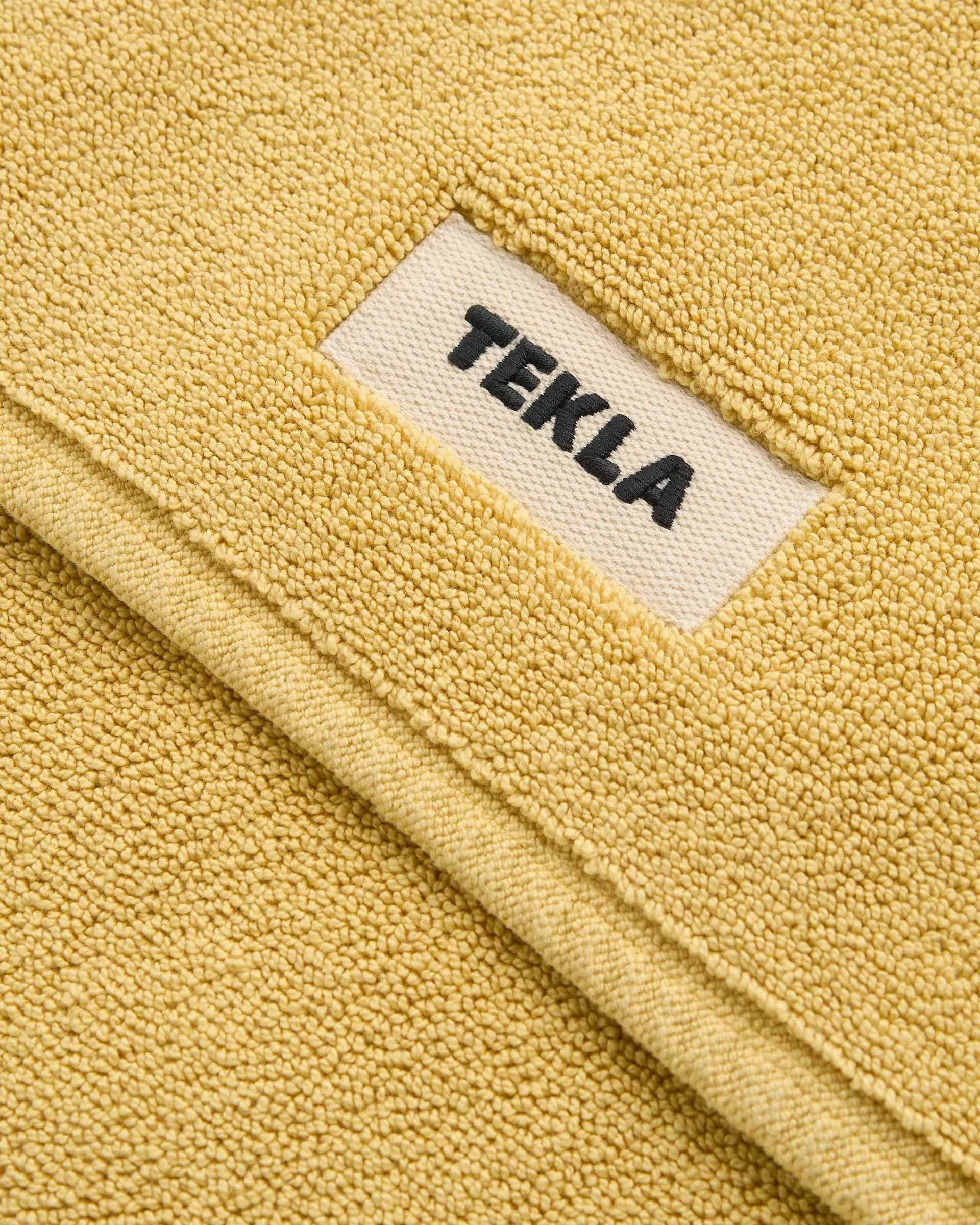 Tekla Fabrics Bath mat – solid – Yellow Ochre
